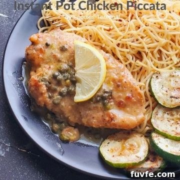 Instant Pot Chicken Thighs with Fluffy White Rice 15 chicken piccata on a black plate with piccata sauce, lemon, noodles & zucchini