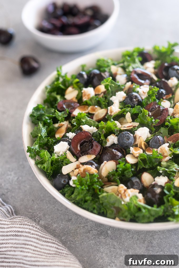 Kale, Cherry and Goat Cheese Salad Recipe 3 Kale cherry salad in a white bowl