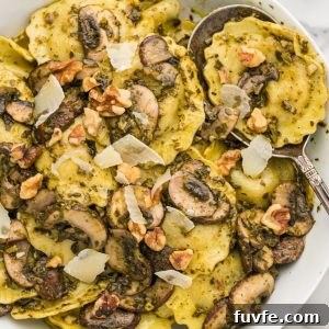 Creamy Mushroom Ravioli with Fresh Basil Pesto 8 Mushroom ravioli in a serving bowl with a spoon