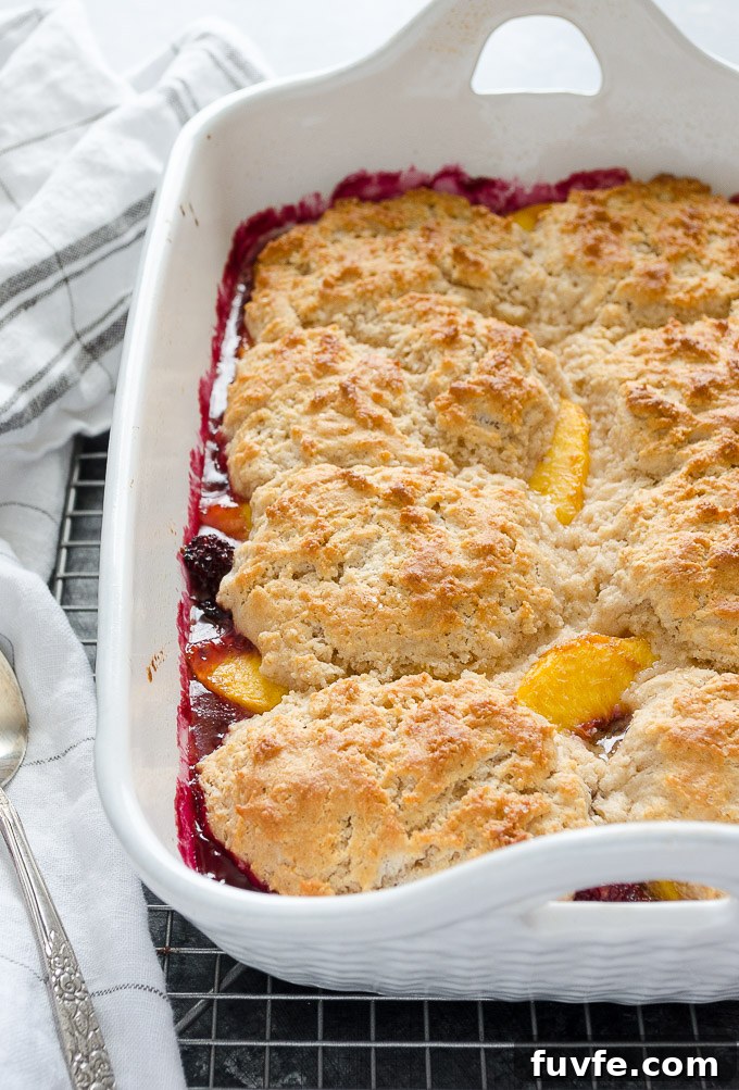 Peach and blackberry cobbler cooling on a wire rack