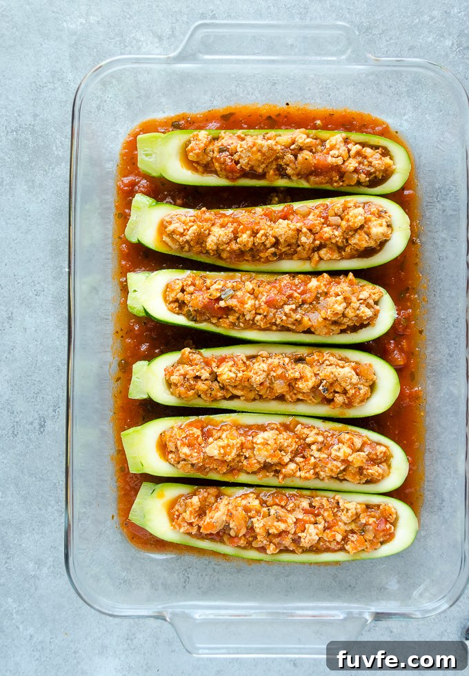 Stuffed zucchini with ground chicken parmesan filling.