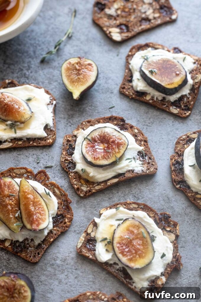 Whipped goat cheese with honey on crackers with fig slices.