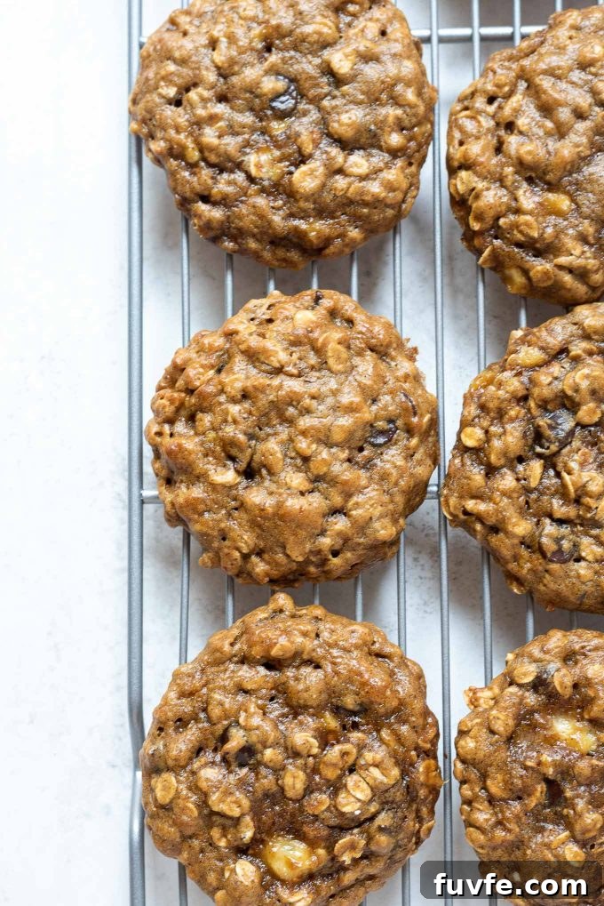 Gluten-Free Peanut Butter Banana Oatmeal Cookies Recipe 3 Peanut butter banana oatmeal cookies on a wire rack