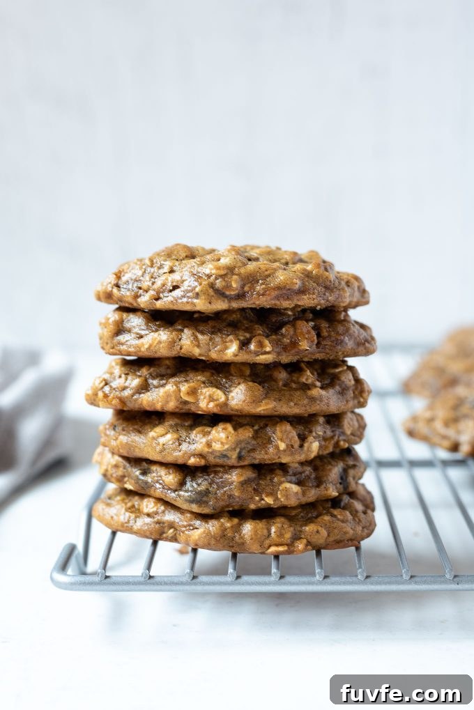 Gluten-Free Peanut Butter Banana Oatmeal Cookies Recipe 7 Stack of peanut butter oatmeal banana cookies on a wire rack