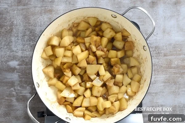 Spiced Pear and Apple Sauce Recipe for Fall 4 Cut and seasoned fruit in pan