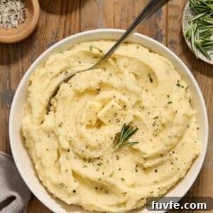 Crock pot mashed potatoes with buttermilk in a bowl.
