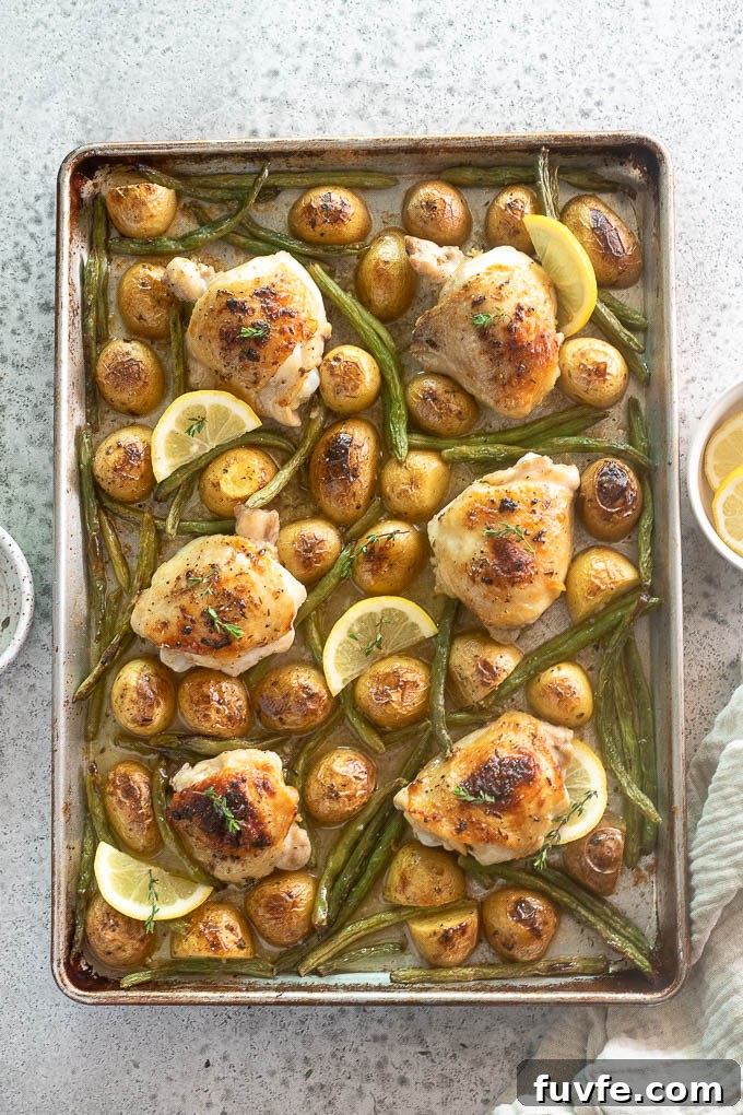 Sheet pan chicken thighs and potatoes with green beans.
