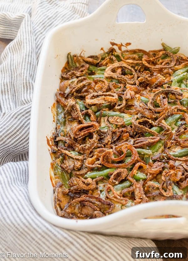 Homemade green bean casserole in baking dish with crispy shallots on top