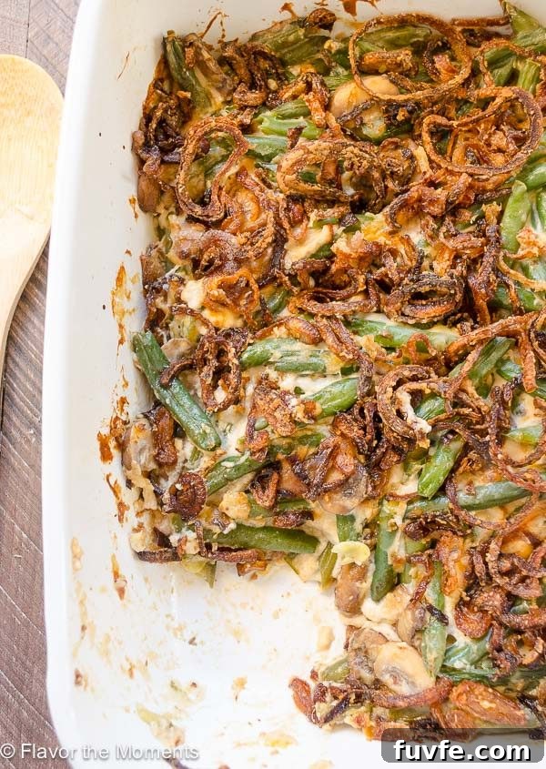 Green bean casserole in baking dish with serving missing