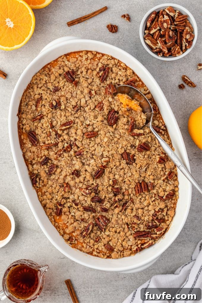 Sweet Potato Casserole with Brown Sugar Streusel 6 Sweet potato casserole in baking dish with a serving spoon