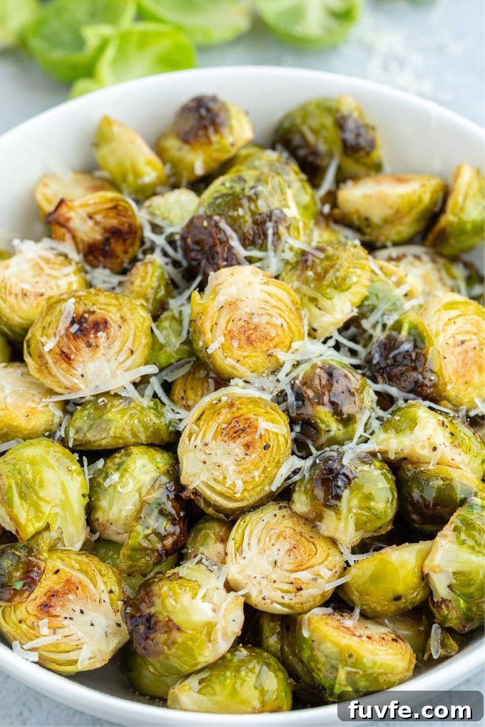 Air fryer brussels sprouts in a bowl with parmesan cheese