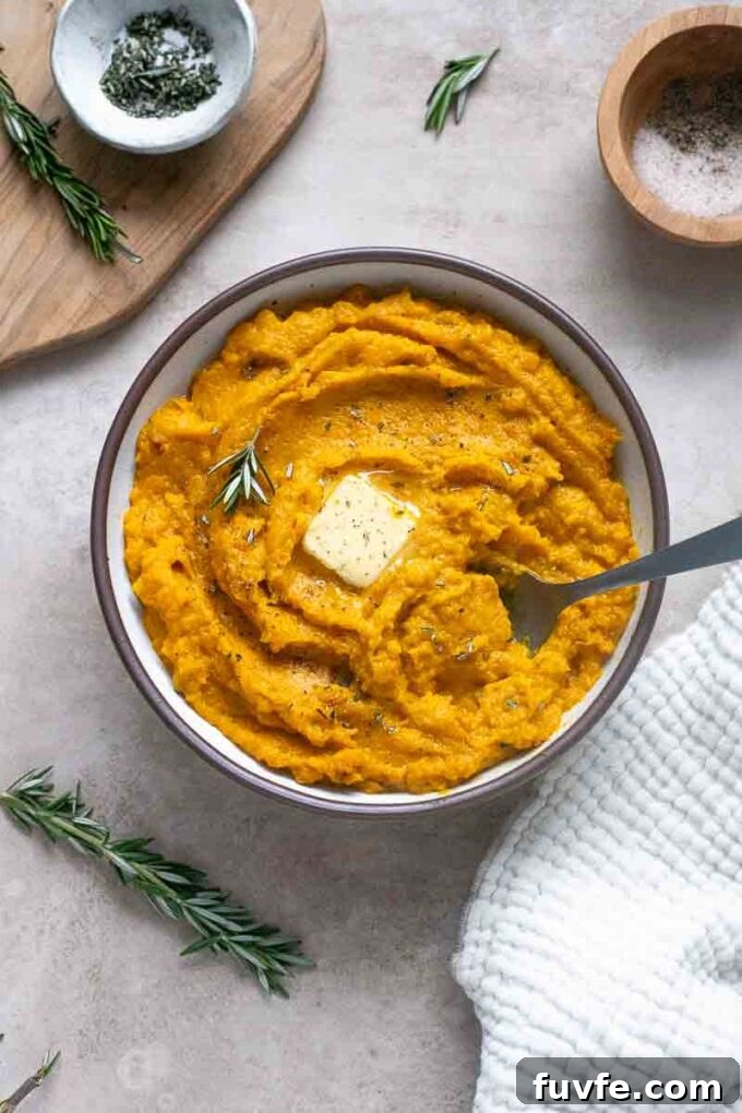 Velvety Kabocha Squash Mash Recipe 9 Mashed kabocha squash in a bowl with melted butter.