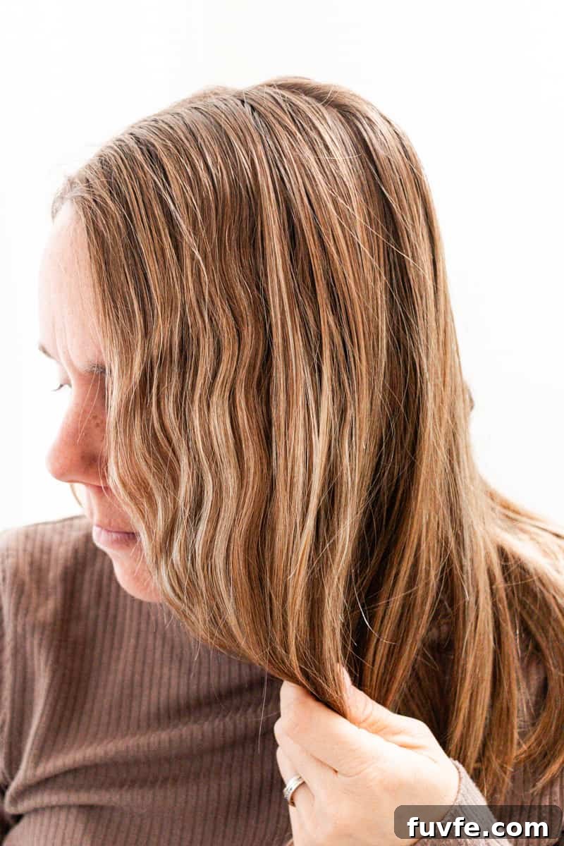 Scrunching up naturally curly hair.