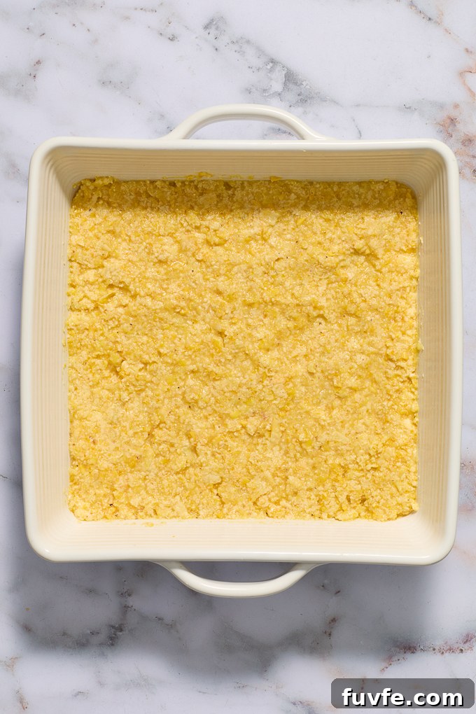 Mexican sweet corn cake in baking dish before baking.