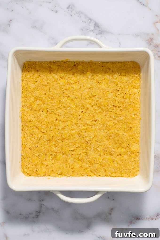 Baked Mexican corn cake in baking dish.