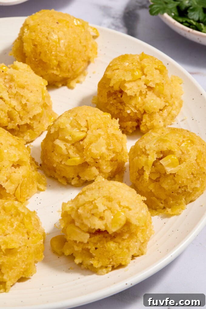 Mexican corn cake scooped onto a plate.