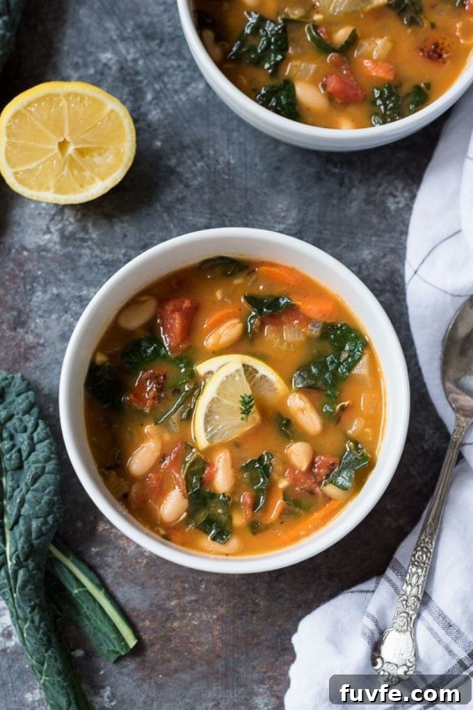 White Bean and Kale Soup Recipe with Garlic and Lemon 3 White bean kale soup with kale, lemon and a linen alongside