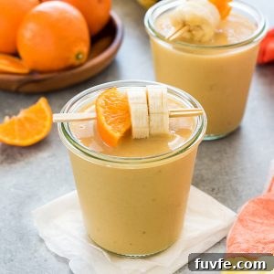 Orange Creamsicle Smoothie with Vanilla Yogurt 6 Orange cream smoothie in a jar with orange and banana skewered on a toothpick