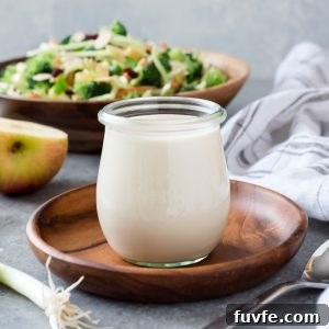Creamy Homemade Coleslaw Dressing Recipe 5 Coleslaw dressing in a jar with broccoli salad behind