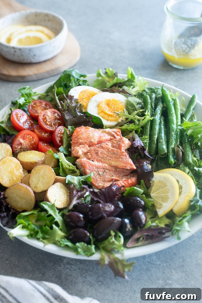 Salmon Nicoise Salad with lemon vinaigrette over the top