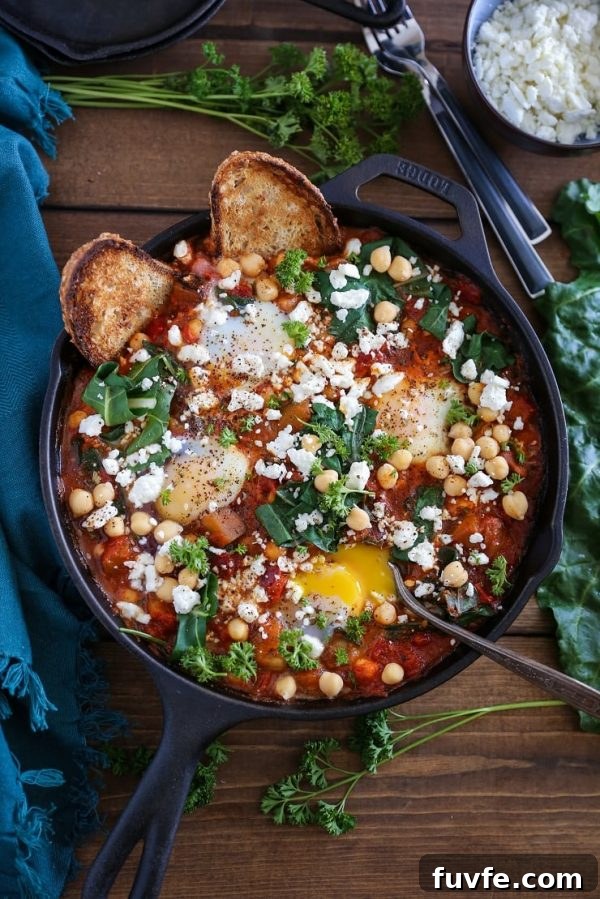eggplant shakshuka in black bowl with toast