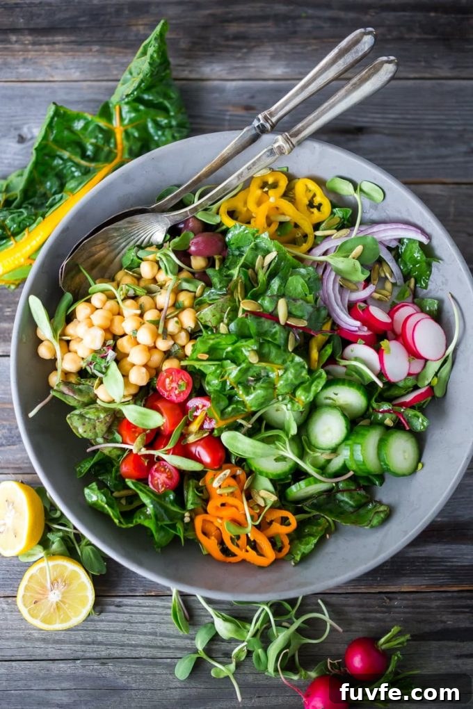Overhead view of a Mediterranean chard salad in a gray bowl.