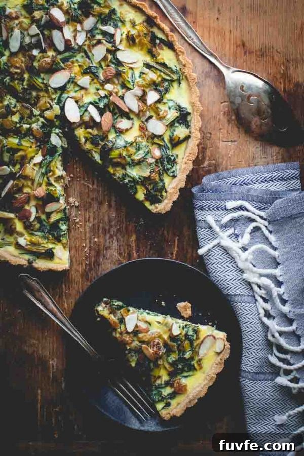 Swiss chard tart with slice on plate
