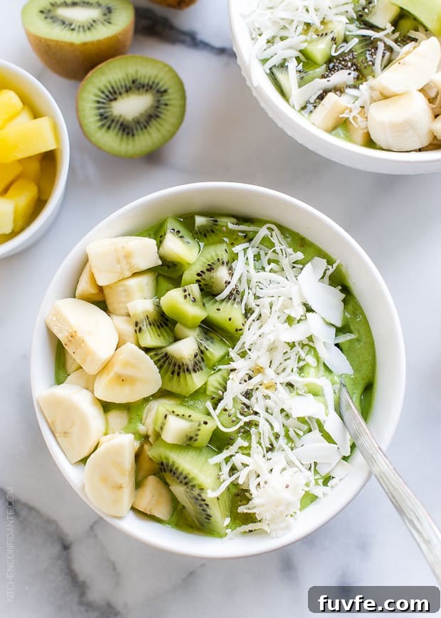 Green Smoothie Bowl topped with kiwi and banana in a white bowl