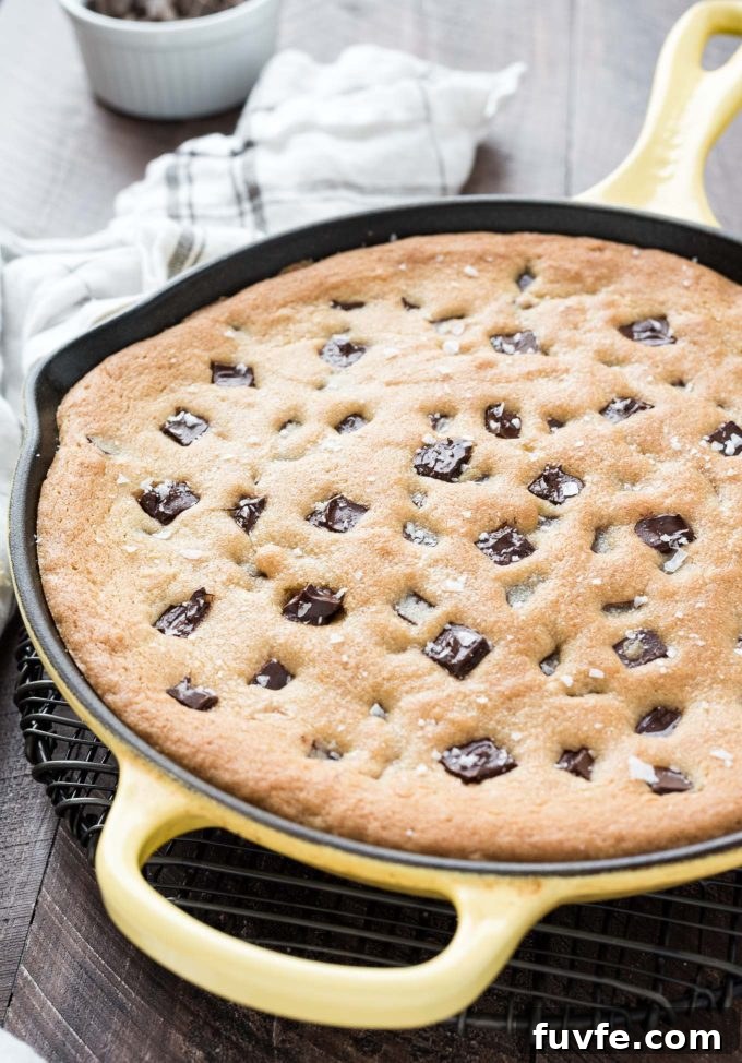 Gooey Cast Iron Chocolate Chip Skillet Cookie 2 Skillet cookie with chocolate chunks and sea salt