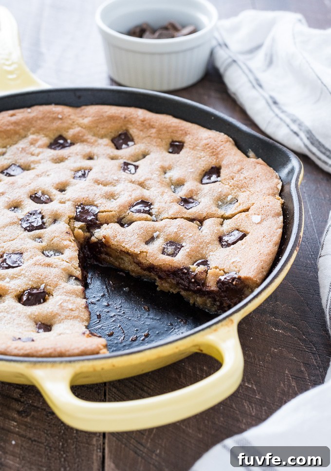 Gooey Cast Iron Chocolate Chip Skillet Cookie 6 Slice of skillet cookie in the pan
