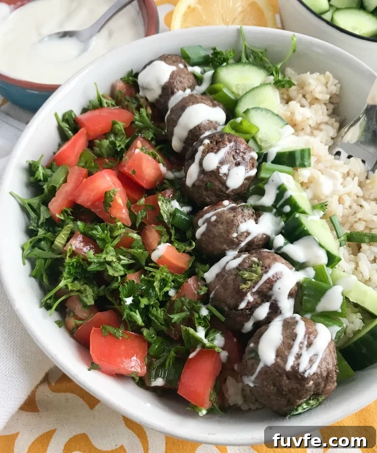 Lebanese Beef Kafta Meatballs with Garlic-Yogurt Sauce 42 Beef Kafta Meatballs with a spoon