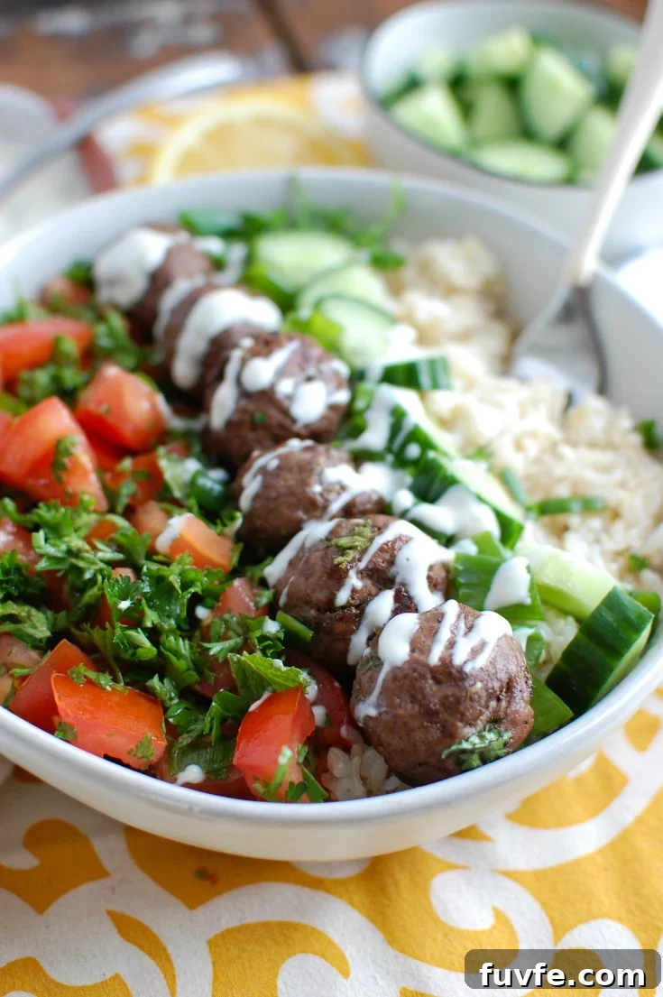 Lebanese Beef Kafta Meatballs with Garlic-Yogurt Sauce 3 Beef Kafta Meatballs in white bowl