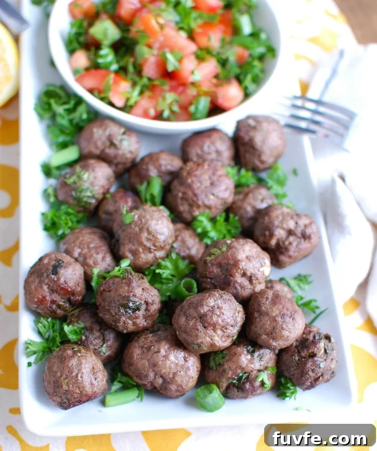 Lebanese Beef Kafta Meatballs with Garlic-Yogurt Sauce 4 Beef Kafta Meatballs on a platter