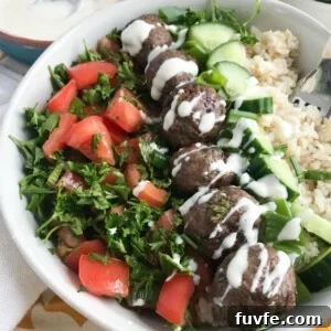 Lebanese Beef Kafta Meatballs with Garlic-Yogurt Sauce 10 Beef Kafta Meatballs with a spoon