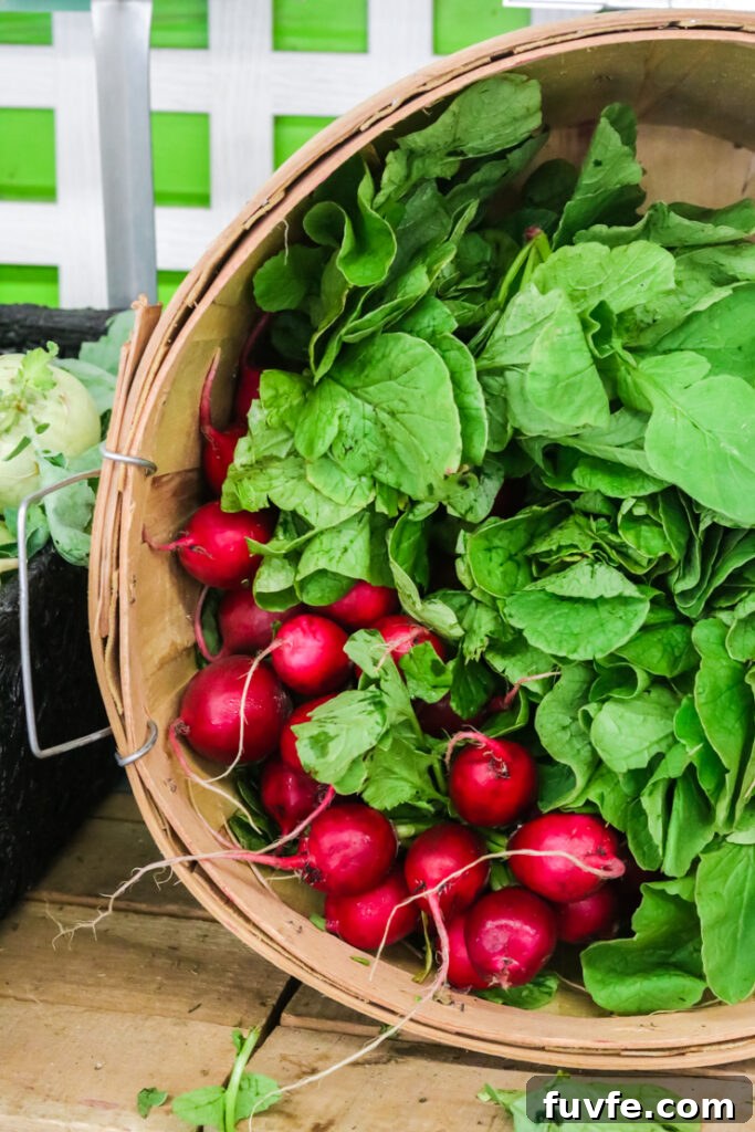 bright red radishes at a farmstand