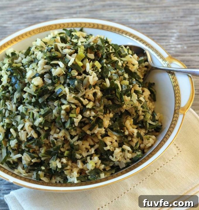 Dirty rice with collards and leeks in a bowl