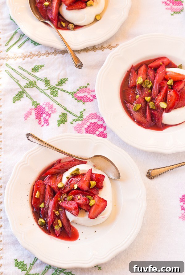 Three dishes of rhubarb meringues on a floral tablecloth.