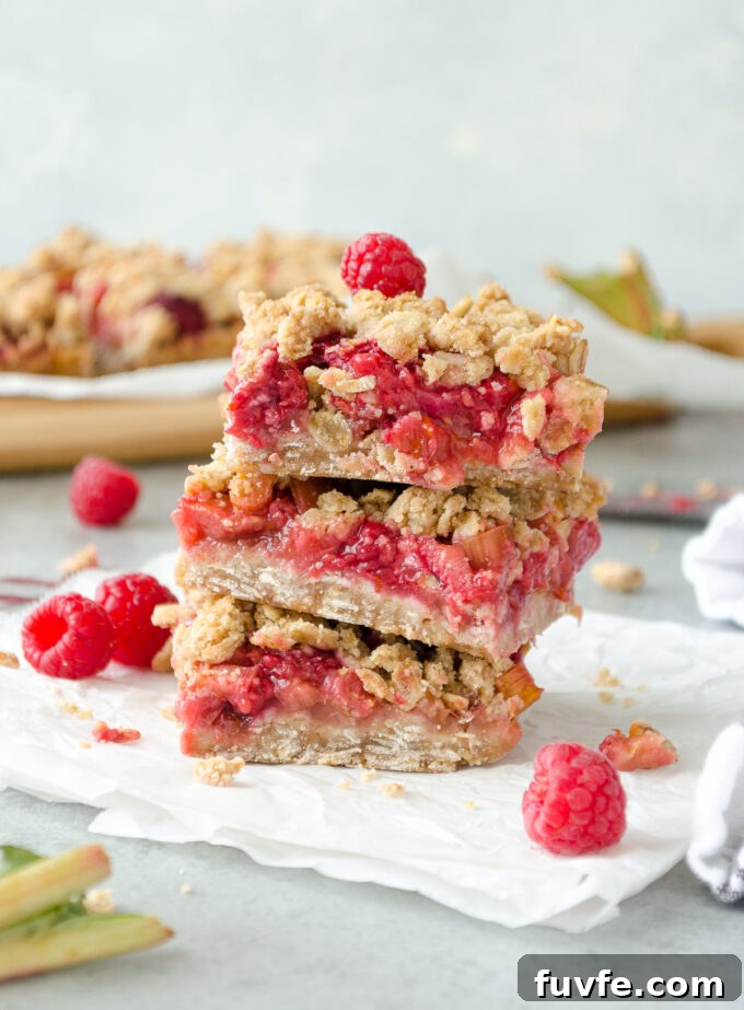 Stack of raspberry rhubarb oatmeal bars.