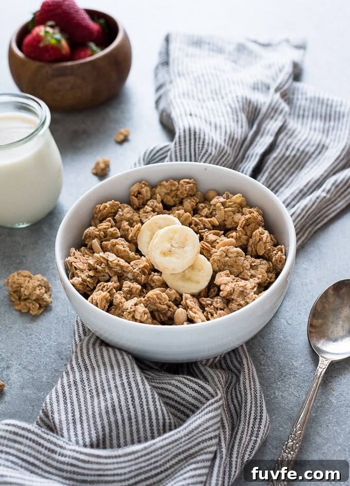 Healthy peanut granola in a bowl with sliced banana on top