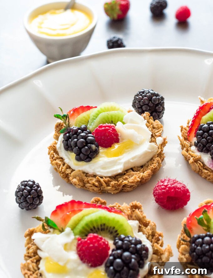 granola crust fruit tart with yogurt and lemon curd close up.