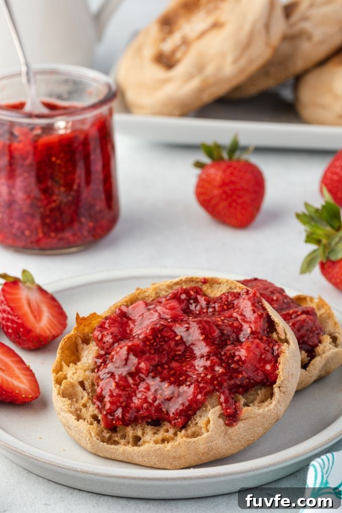 No-Cook Chia Seed Jam Recipe 7 strawberry chia jam slathered on an English muffin
