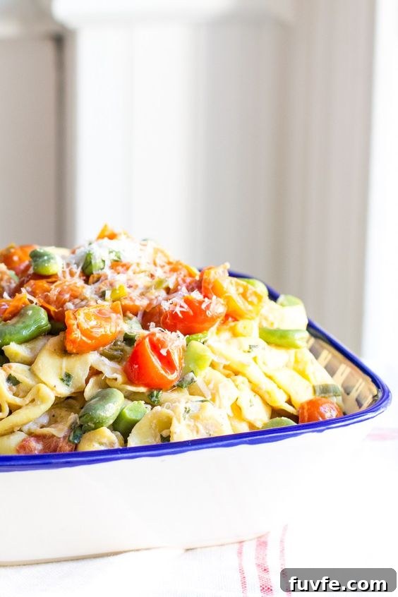 Cheese tortellini with fava beans in a serving dish