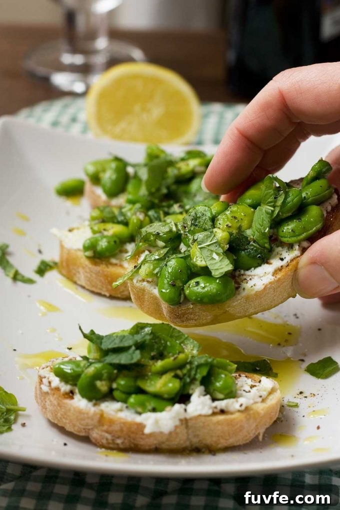 Fava bean crostini on a white plate