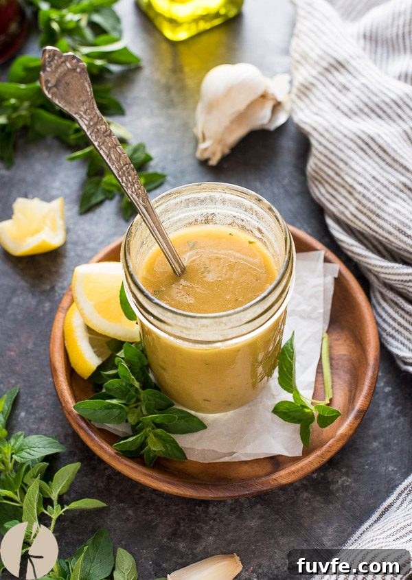 Greek salad dressing with spoon dipped in