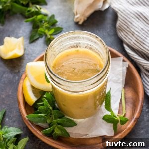 Classic Greek Salad Dressing Recipe 7 Greek dressing in mason jar with oregano and lemon