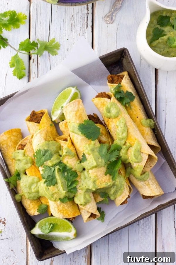 Baked black bean sweet potato taquitos on parchment