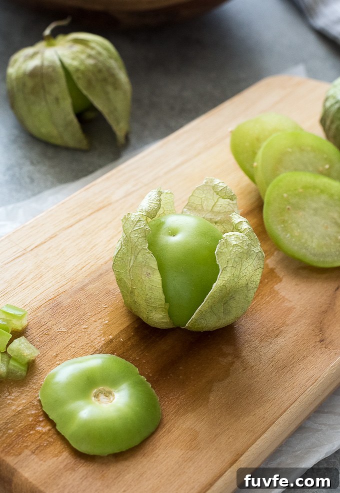 27 Tomatillo Recipes and How to Buy, Store, and Cook 3 tomatillos on a cutting board