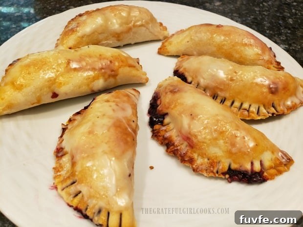 The blackberry handpies are brushed with the glaze, and then are ready to eat!