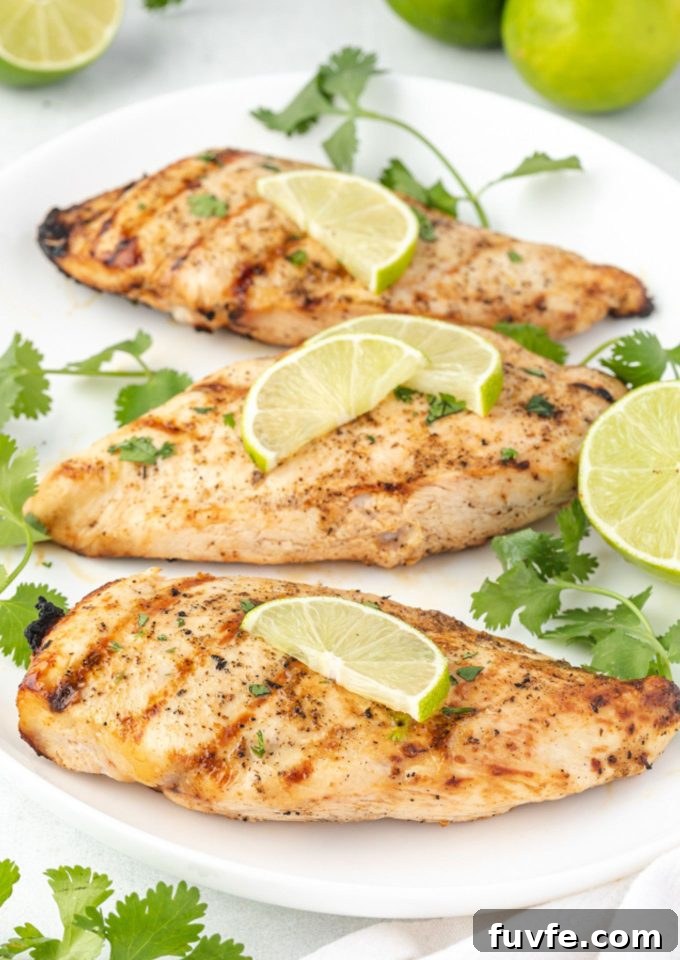 Grilled tequila lime chicken on a white platter