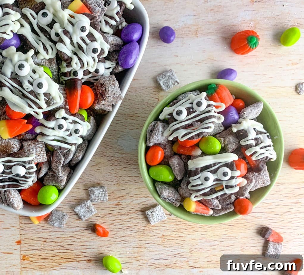 Spooky Halloween Chex Mix Recipe for Parties and Treats 9 This Halloween Snack Mix is full of chocolate covered Chex cereal, ghoul colored Peanut M&M's, candy corn and candy pumpkins and DIY chocolate covered Mummies!